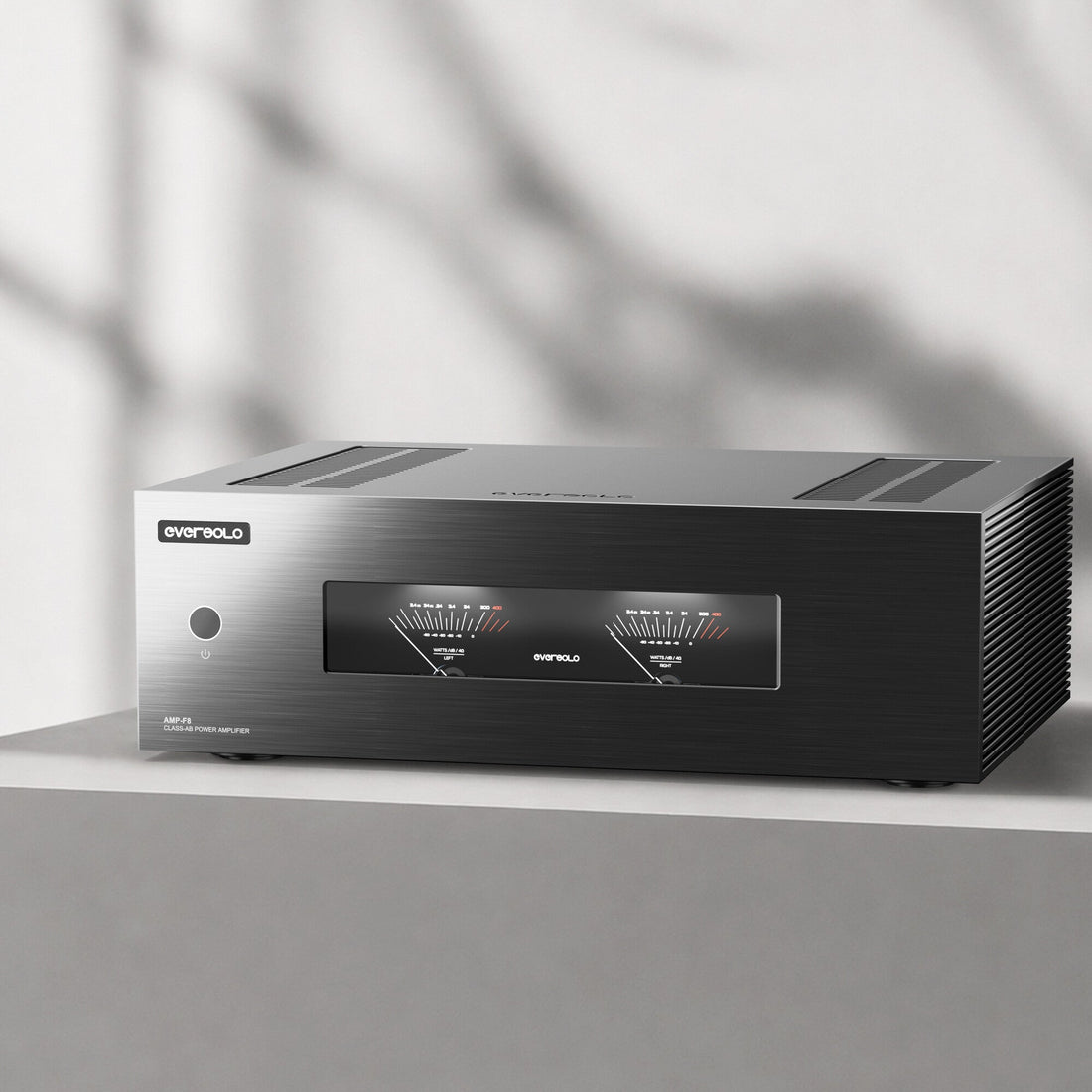 Eversolo AMP-F8 power amplifier on a concrete shelf in soft daylight
