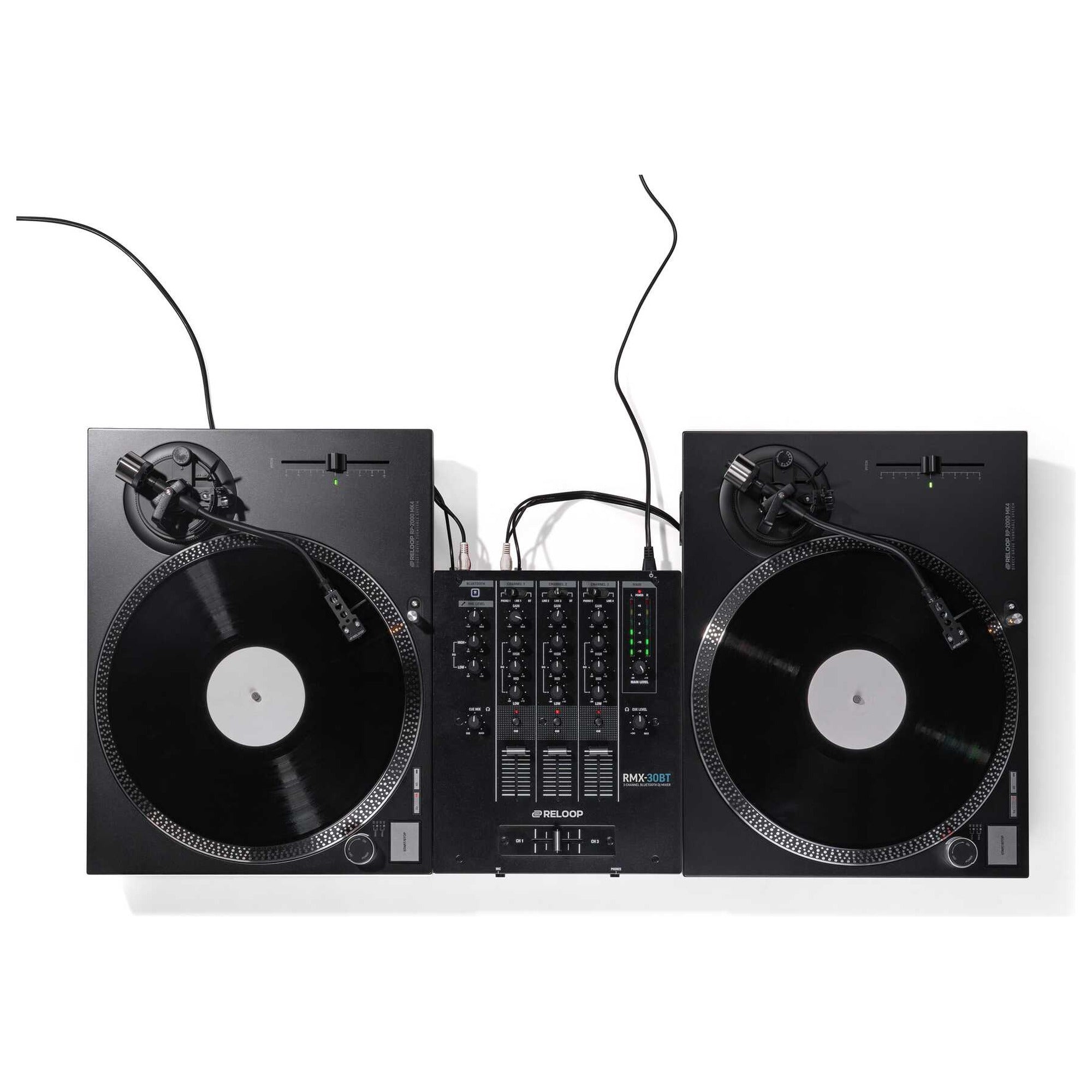 Two Reloop RP-2000 MK4 turntables set up in battle position with a mixer