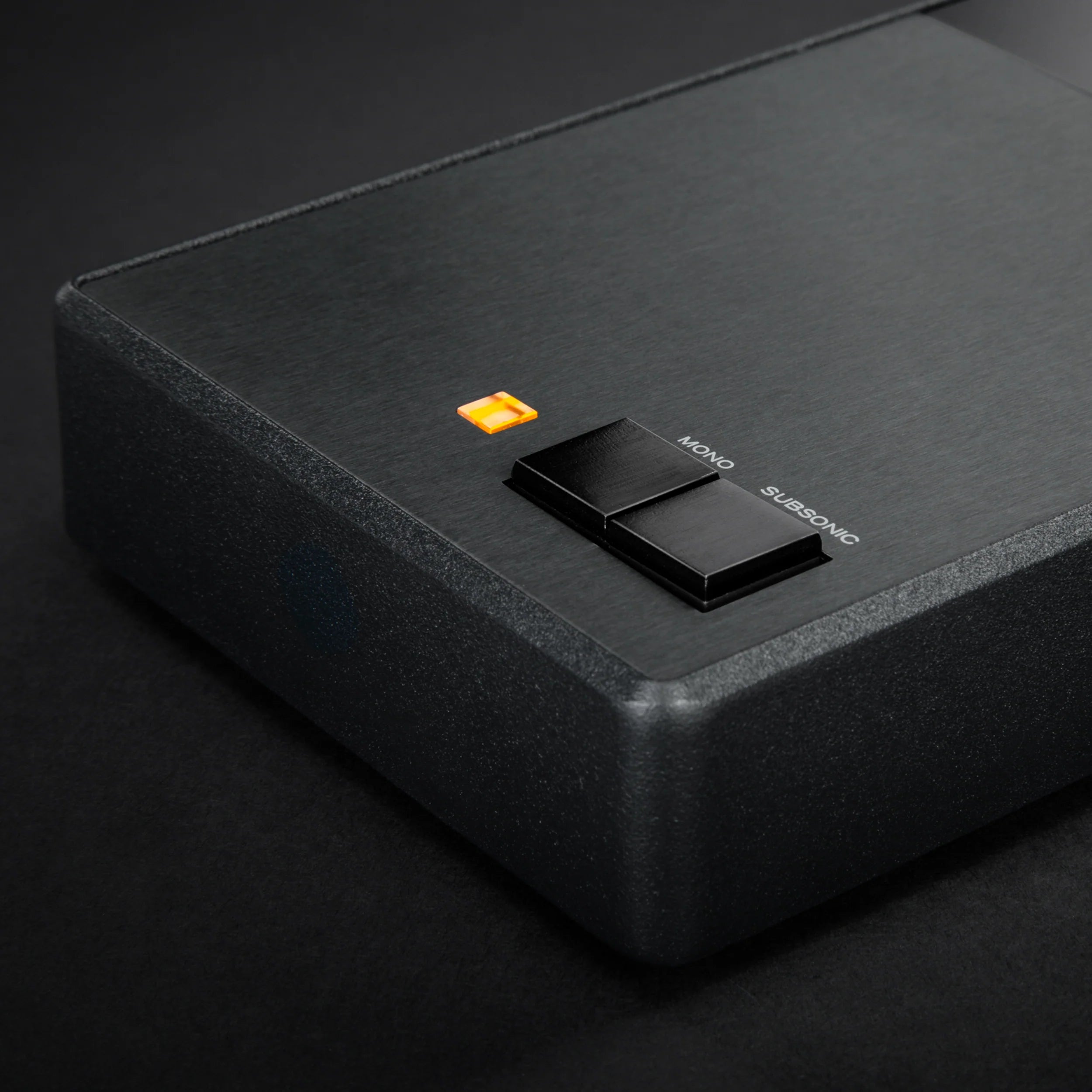 Close-up of MoFi Electronics StudioPhono phono preamp showing input and control knobs on a sleek black device.