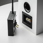 Pro-Ject Wireless Box E Bluetooth and Wi-Fi audio receiver connected to a home audio system.