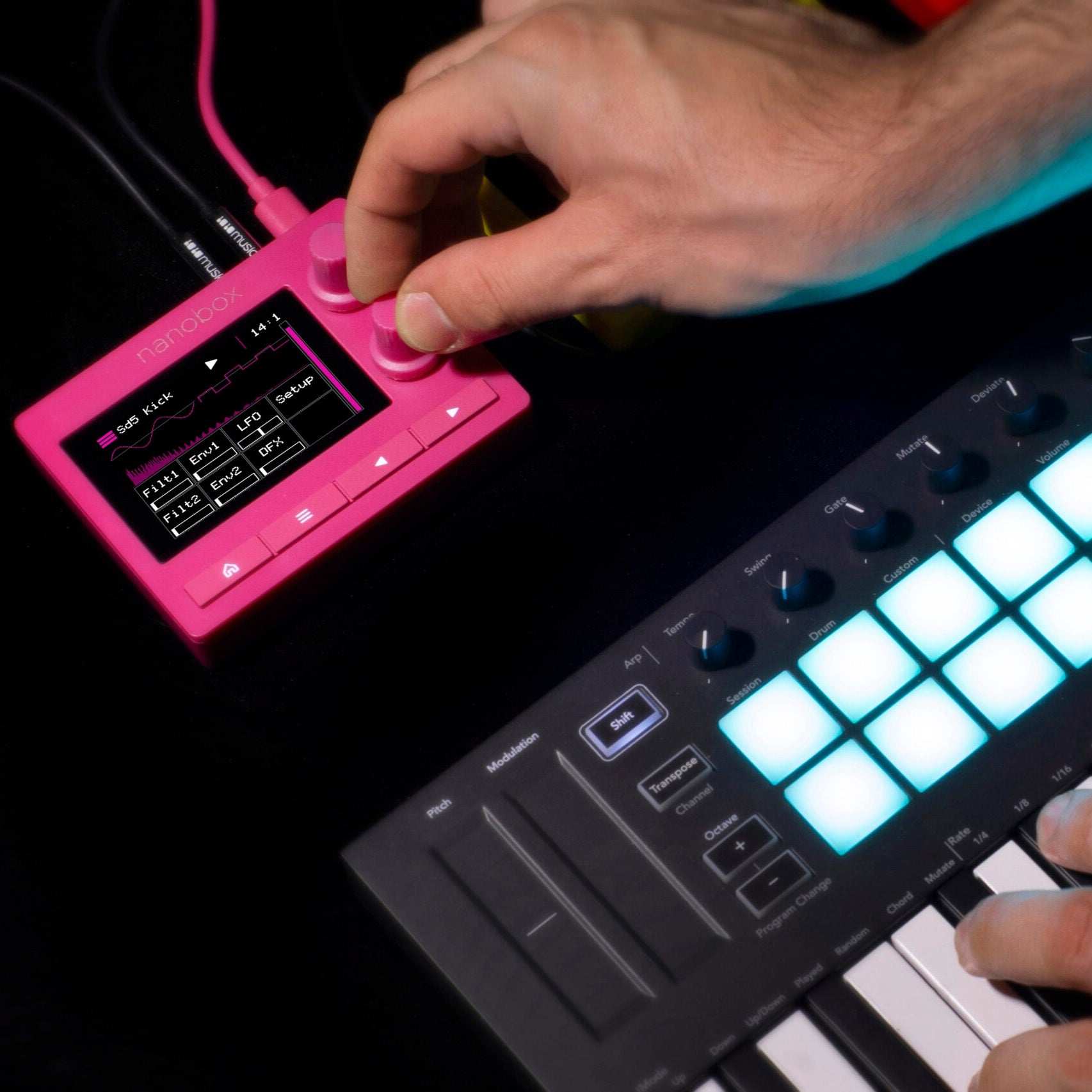1010music Nanobox Razzmatazz drum machine and sampler with colorful interface, knobs, and buttons for music production.