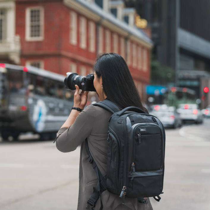 Think Tank Walker Pro Series backpack for video equipment, with multiple compartments and padded straps for comfortable carrying.