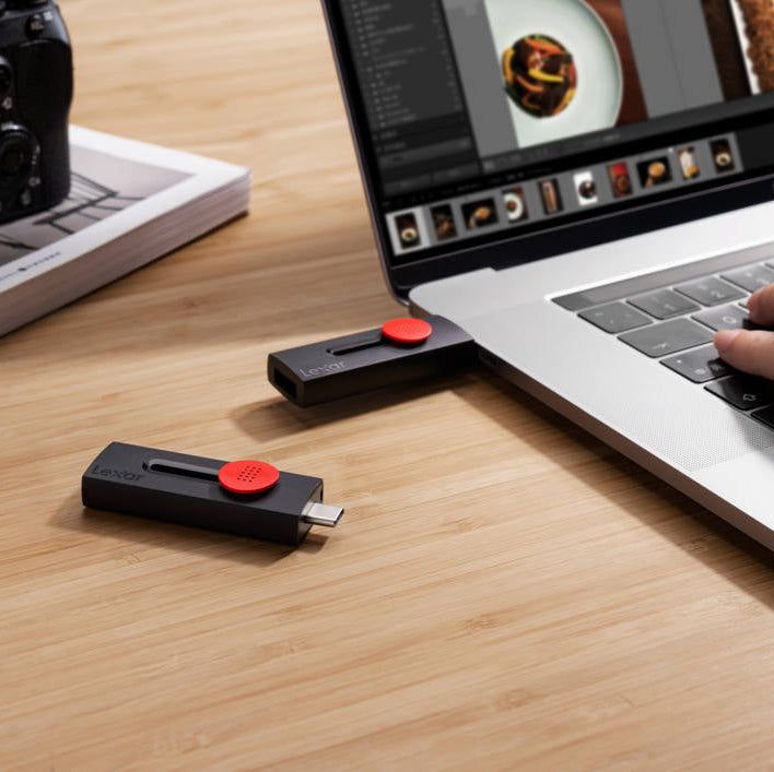 Lexar Jumpdrive D300 R100 USB 3.2 flash drive with USB-A and USB-C ports on a sleek, modern storage device.