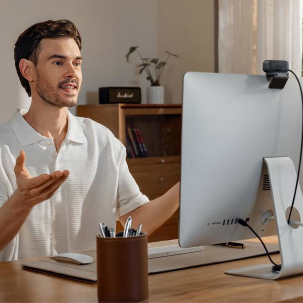Insta360 Link 2C Pro video conferencing camera with adjustable lens and sleek design, ideal for professional virtual meetings.