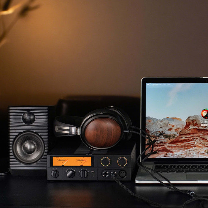 FiiO K15 headphone amplifier and DAC device with front input ports and sleek black design.
