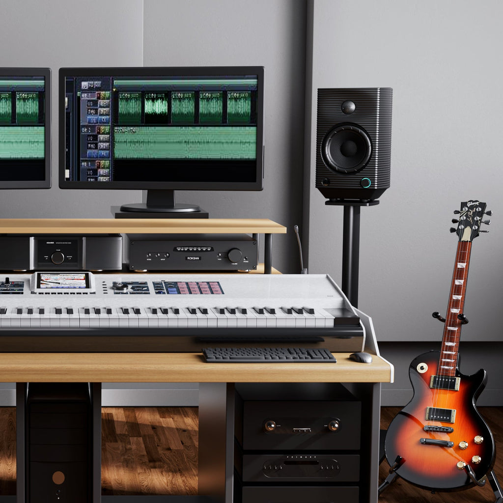 FiiO SP5 desktop speakers with compact design, black finish, and front-facing speaker grille for high-quality audio.