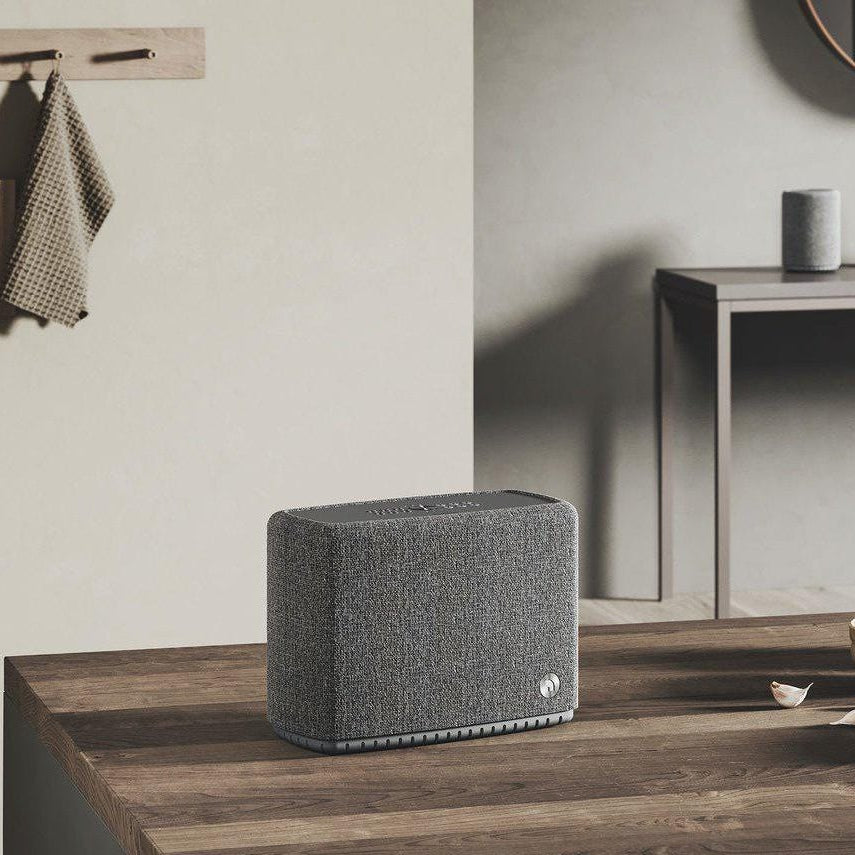Audio Pro A15 portable speaker with sleek black design, compact size, and built-in controls for high-quality sound.
