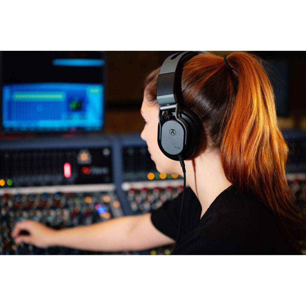 Austrian Audio Hi-X55 studio headphones with over-ear design and black ear cups, shown on a plain background.