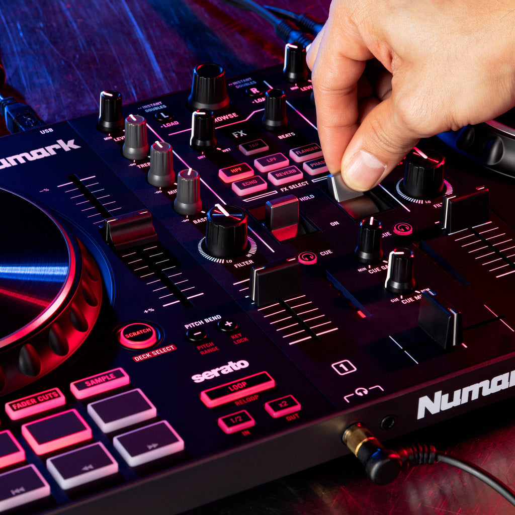 Numark Mixtrack Platinum FX DJ controller with jog wheels, faders, and control knobs for digital music mixing.
