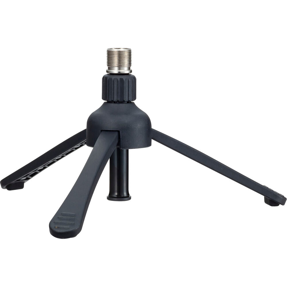 Zoom ZDM-1 Podcast Mic Pack studio bundle featuring microphone, pop filter, and adjustable stand on a wooden table.