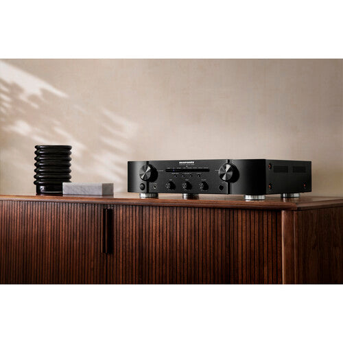 Marantz PM6007 stereo amplifier with sleek black finish, front panel controls, and input selection buttons.