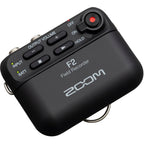 Zoom F2 digital recorder with compact design, featuring multiple input options and professional audio recording capabilities.