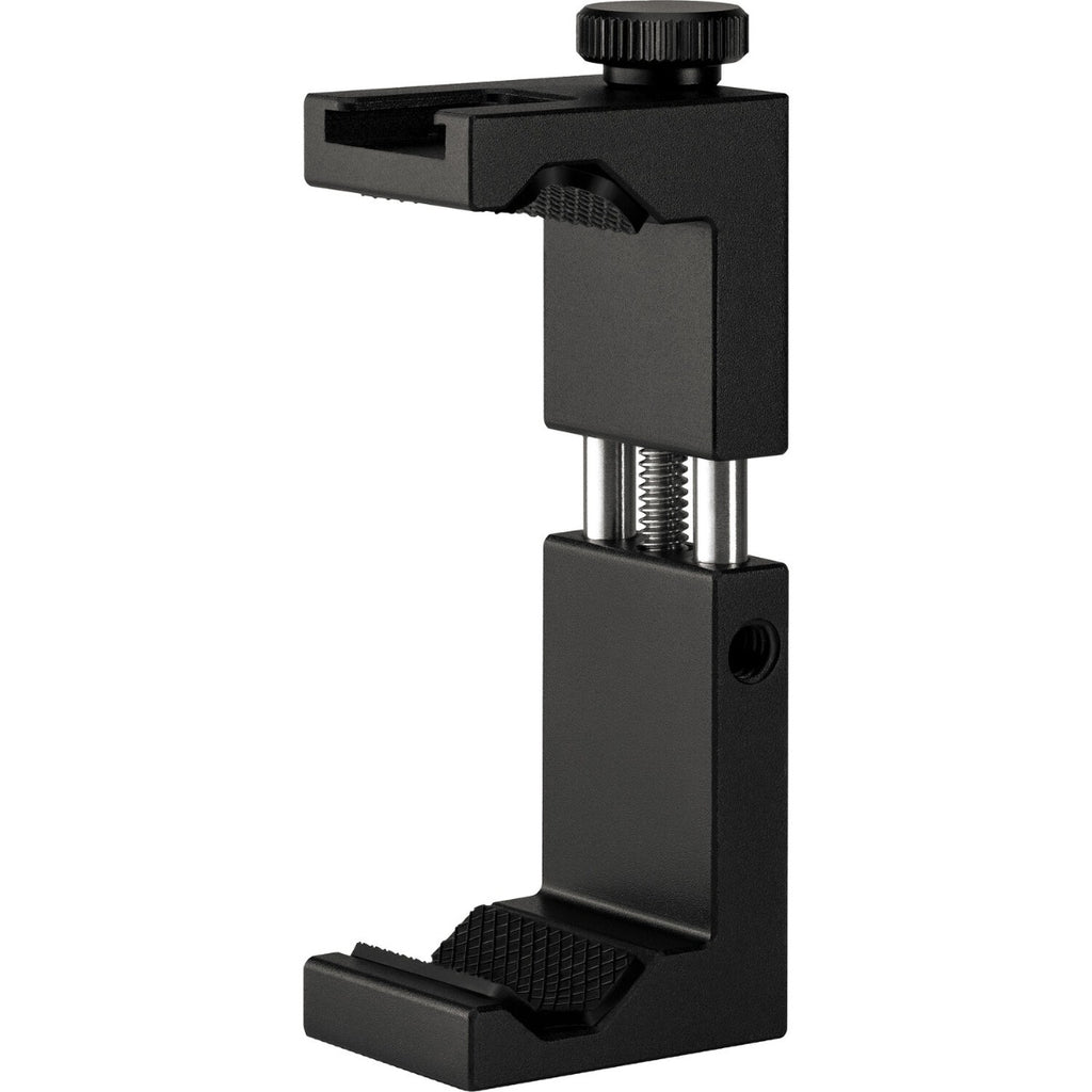 Rode Vlogger Kit with microphone, smartphone mount, and accessories for iOS and Android devices on a wooden surface.