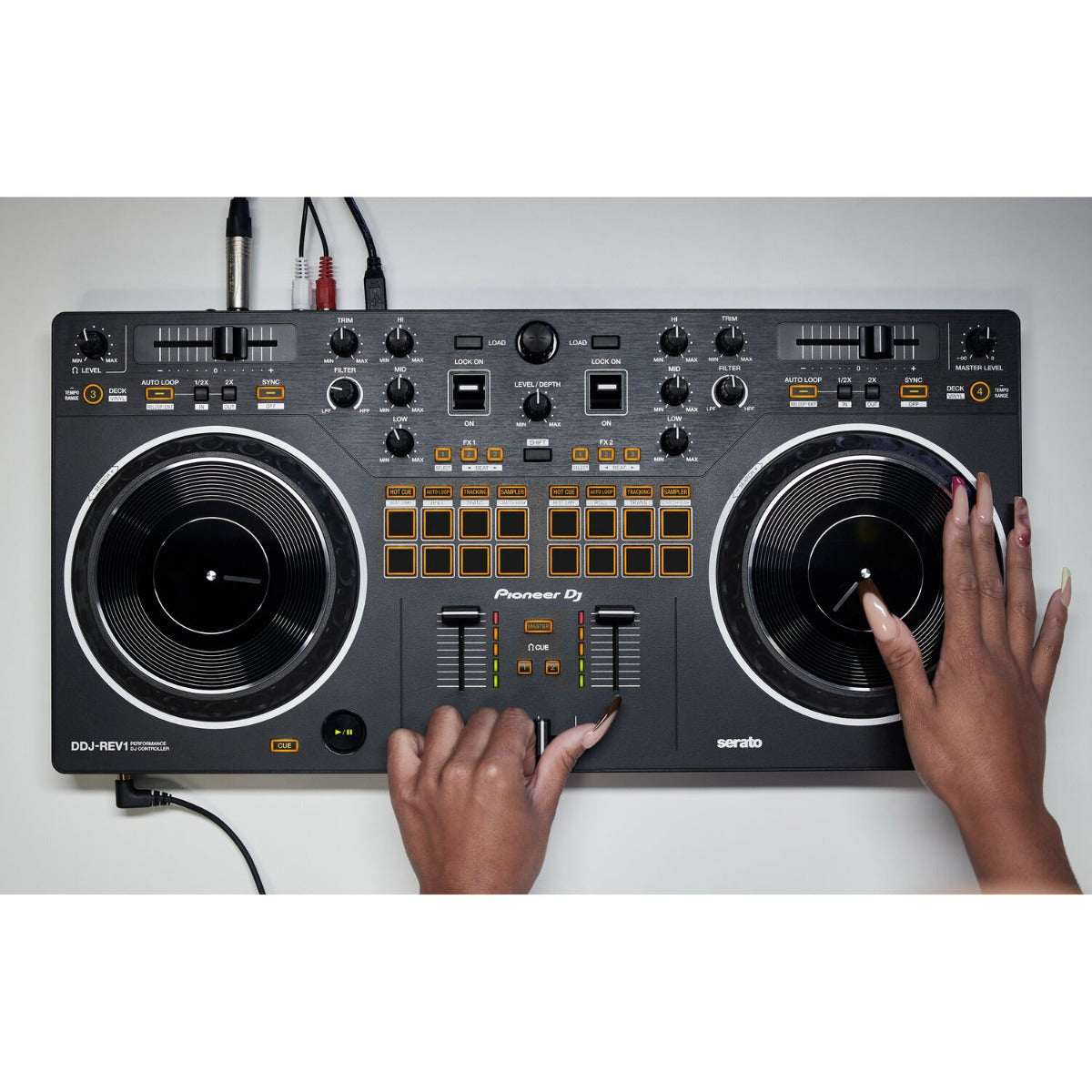 Black Pioneer DJ DDJ-REV1 DJ controller with jog wheels, mixer controls, and performance pads for professional DJ setup.
