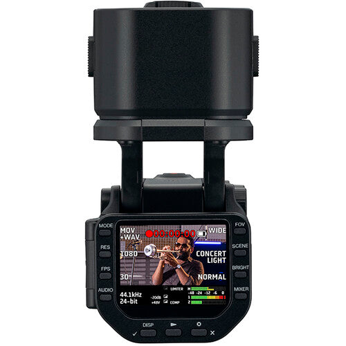 Zoom Q8n-4K video camera with adjustable lens and multiple ports, captured in a close-up shot showing controls and connections.