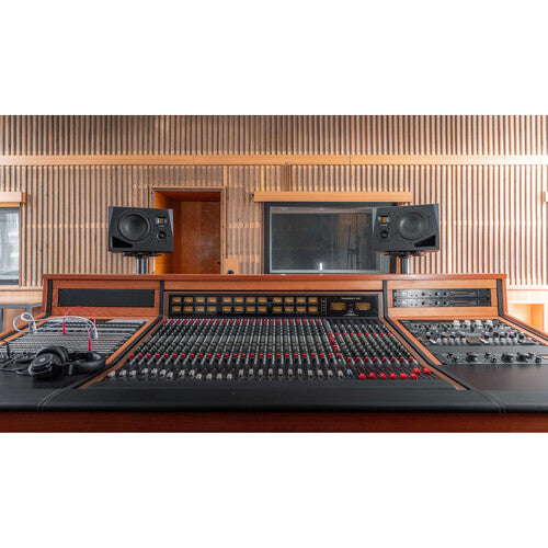 Adam Audio A8H mid-field main monitor speaker, left speaker showing a sleek black enclosure with control panel and driver components.