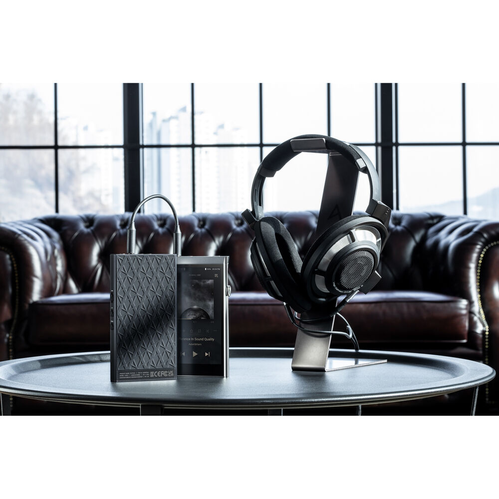 Astell&Kern AK PA10 portable headphone amplifier with sleek black design and visible input ports.