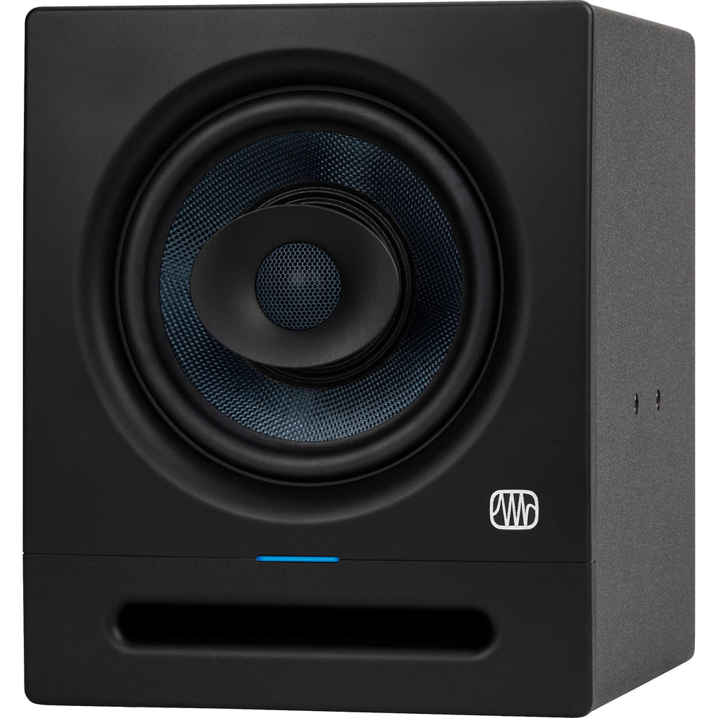 Presonus Eris Pro 8 active nearfield studio monitors shown on a desk with audio equipment, highlighting their sleek black design.
