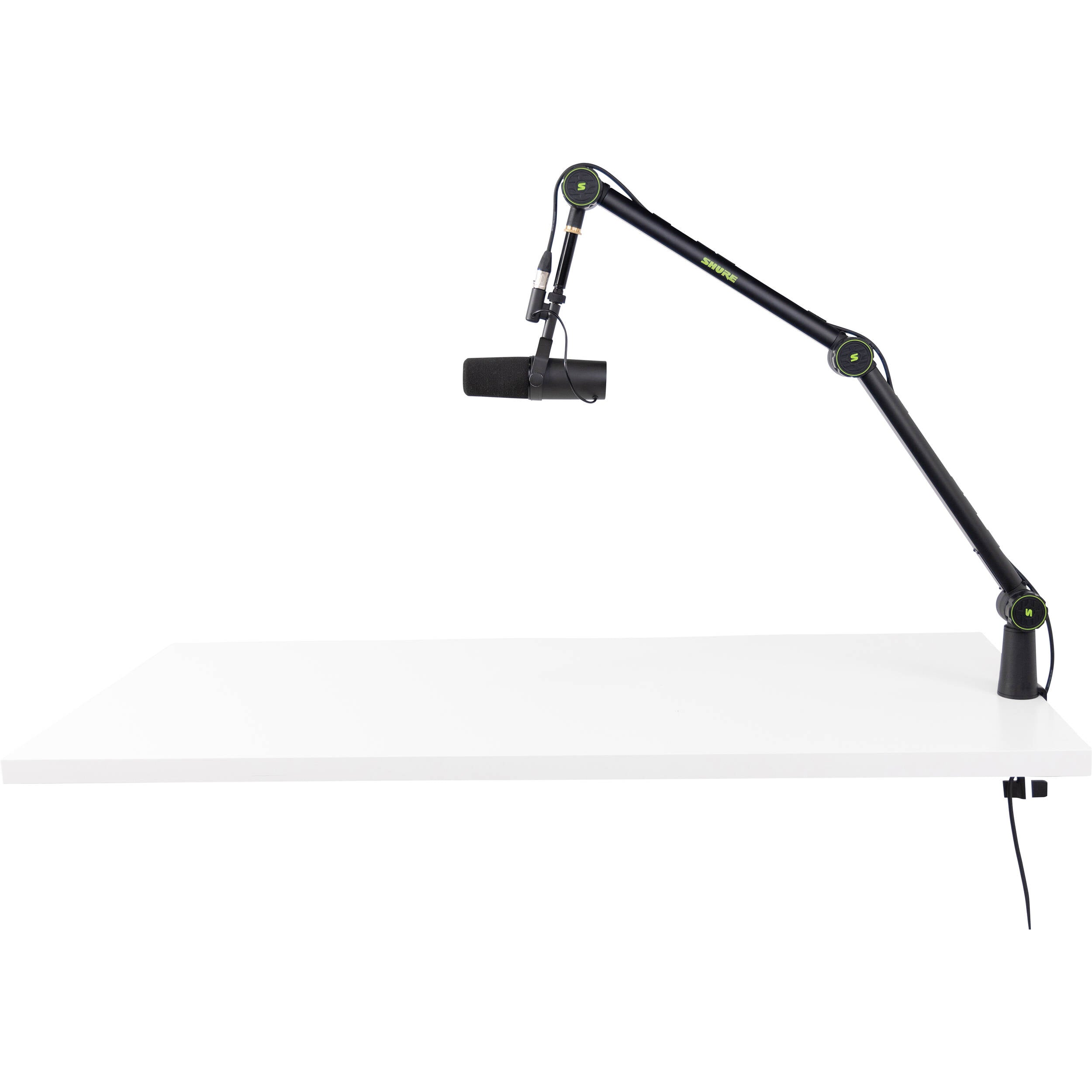 Shure SH-BROADCAST1 broadcast microphone arm mounted on a desk with microphone attached for professional audio recording setup