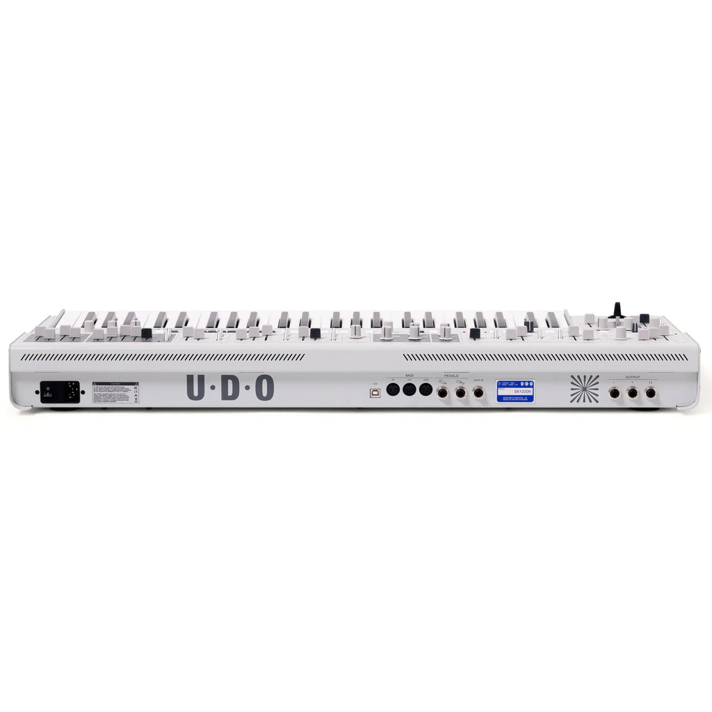 UD0 Audio Super 6 synthesizer keyboard with multiple control knobs and keys, showcasing its professional music production interface.