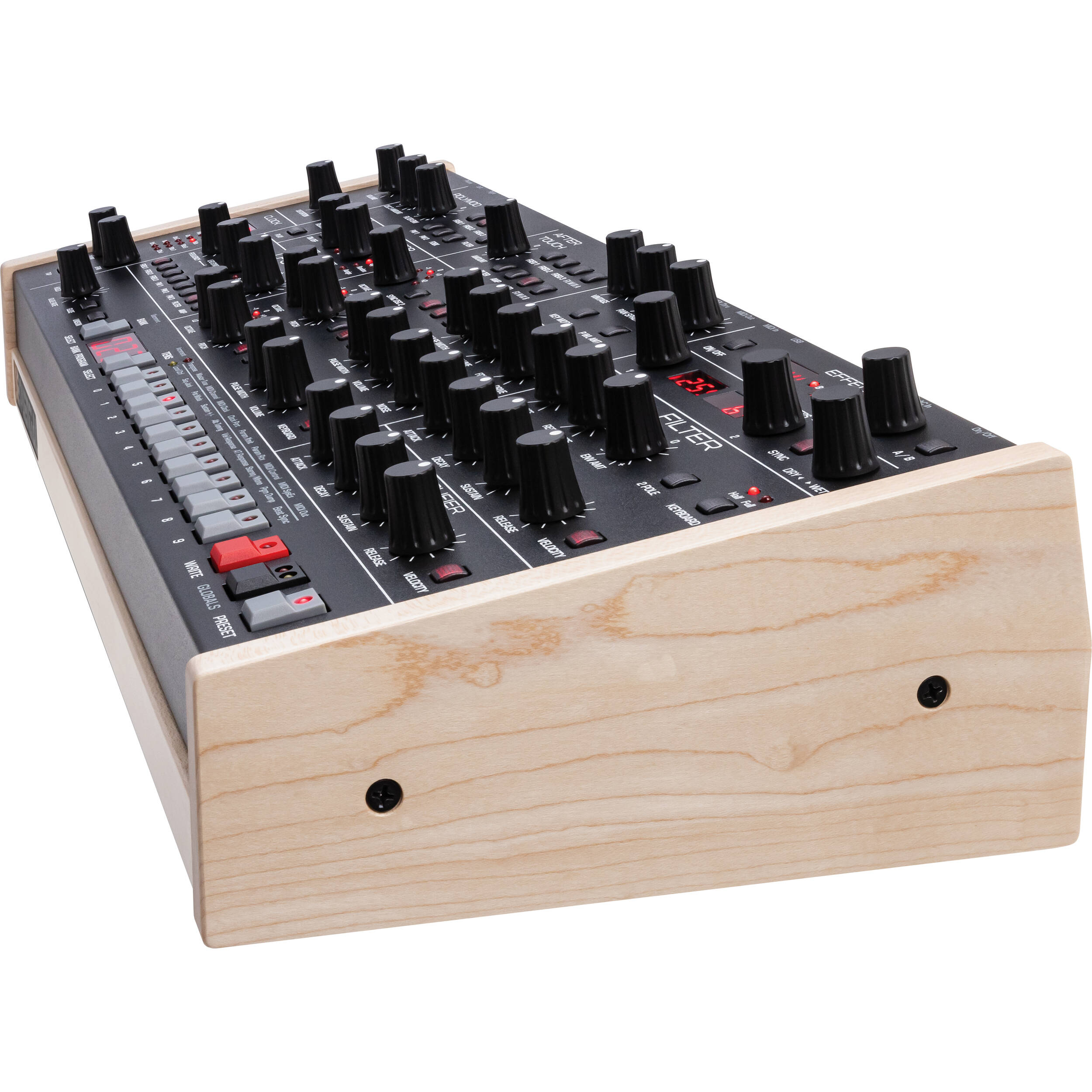 Sequential Trigon-6 desktop synthesizer showing front panel with knobs, switches, and colorful patch points for sound design.