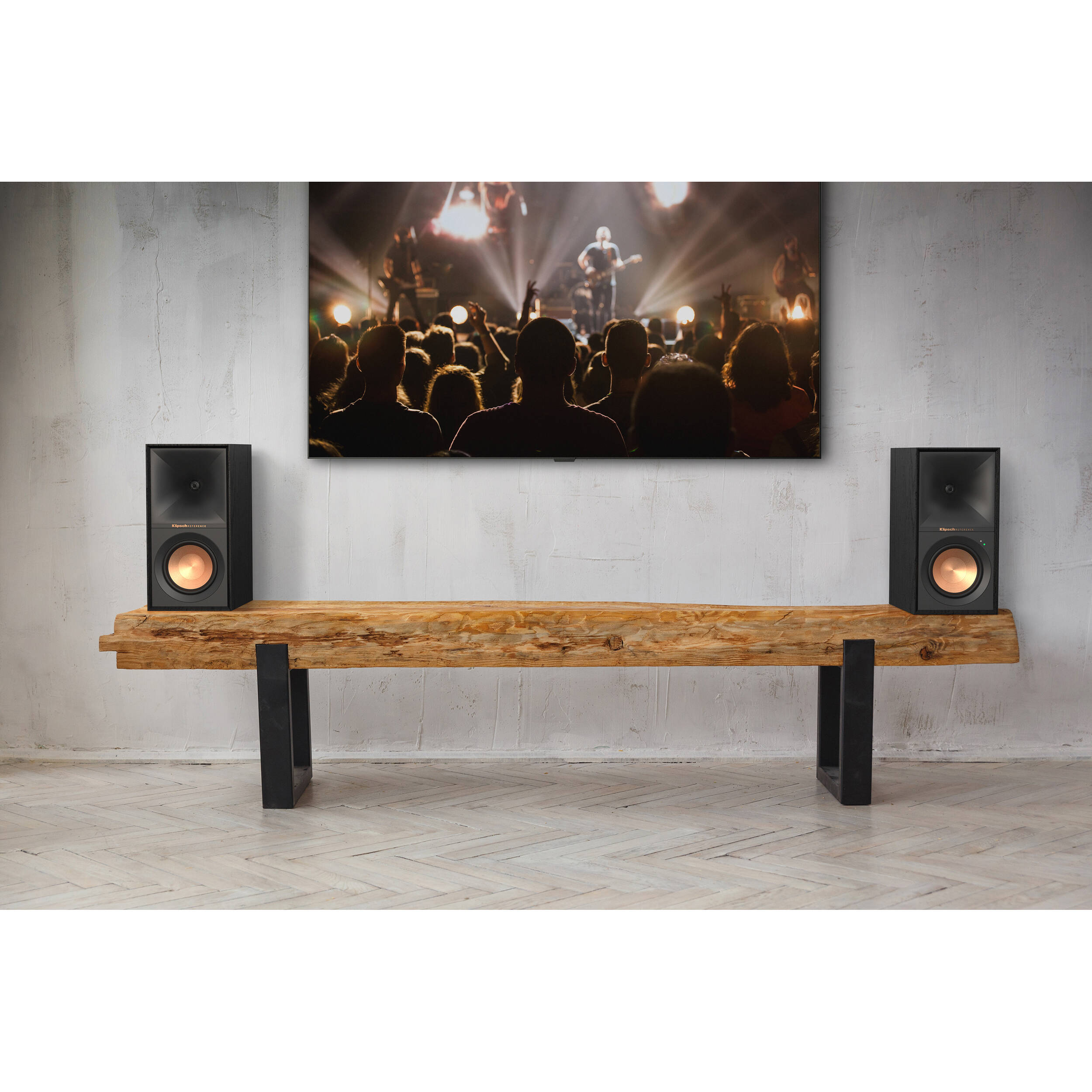 Black Klipsch R-50PM wireless speakers with sleek design and compact size, showcasing their front speaker grille and control panel.