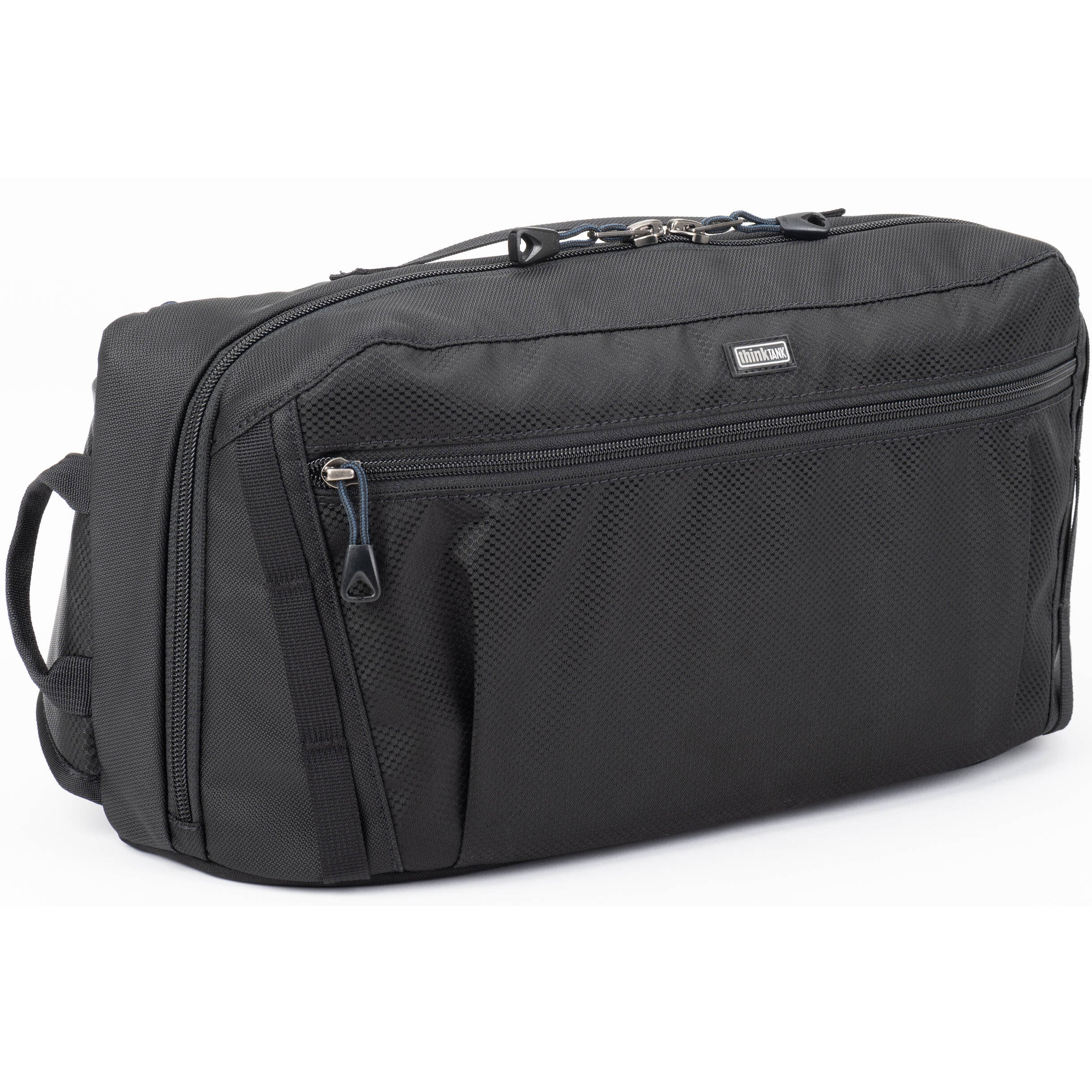 Think Tank PressPass Sling Bag for video equipment, black nylon with adjustable strap and multiple compartments.