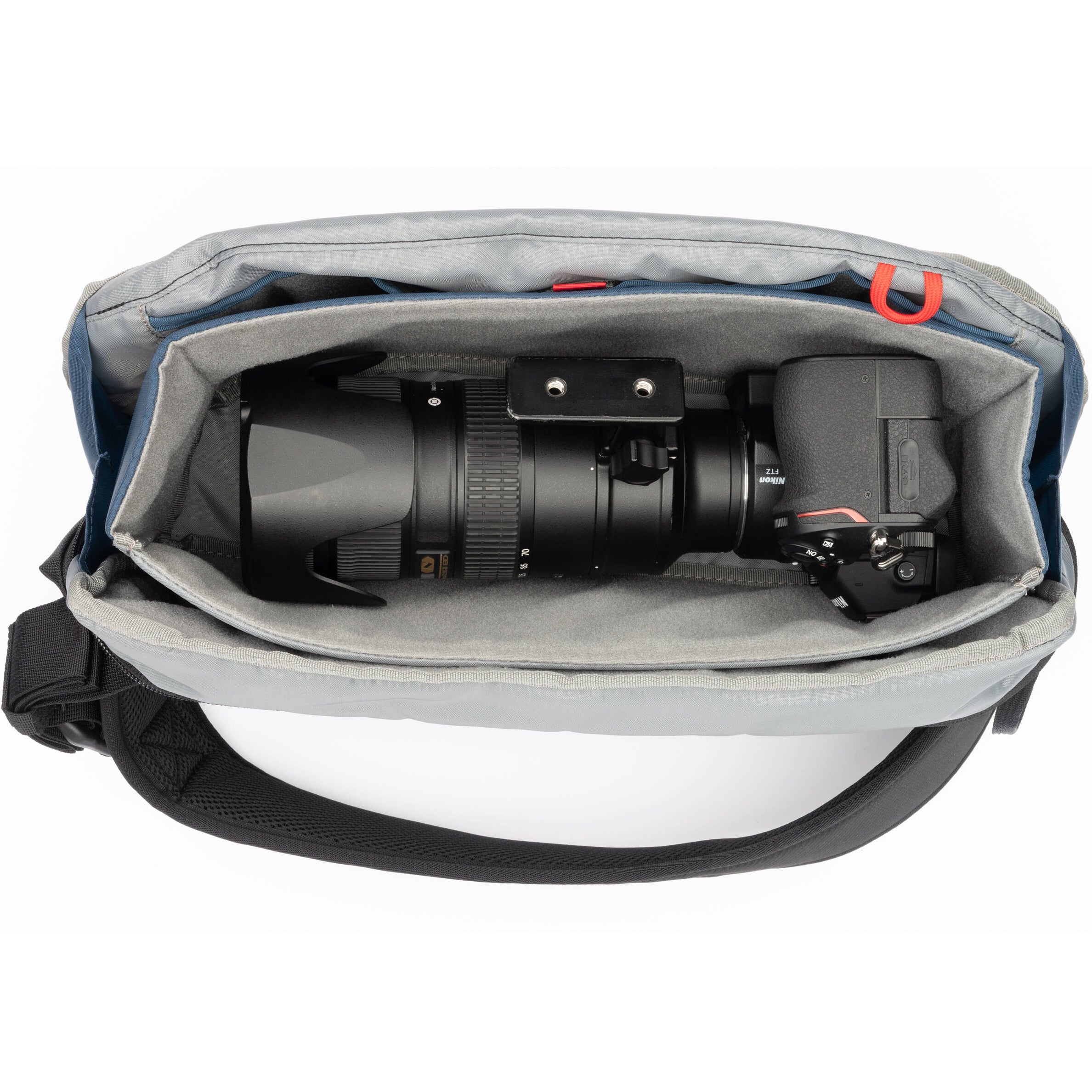 Think Tank PressPass Sling Bag for video equipment, black camera gear bag with adjustable strap and multiple compartments.