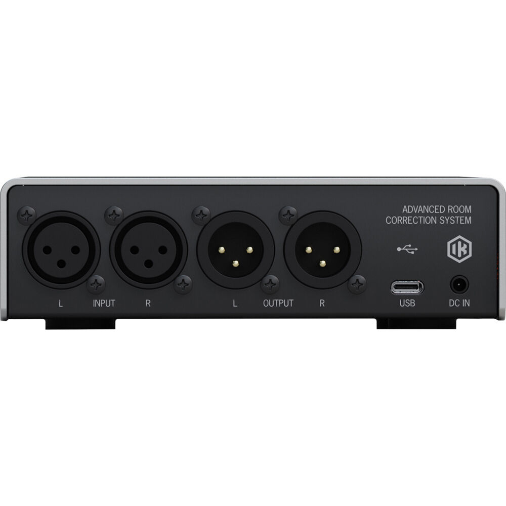 IK Multimedia ARC Studio room calibration device with interface and microphone for accurate acoustic measurement.