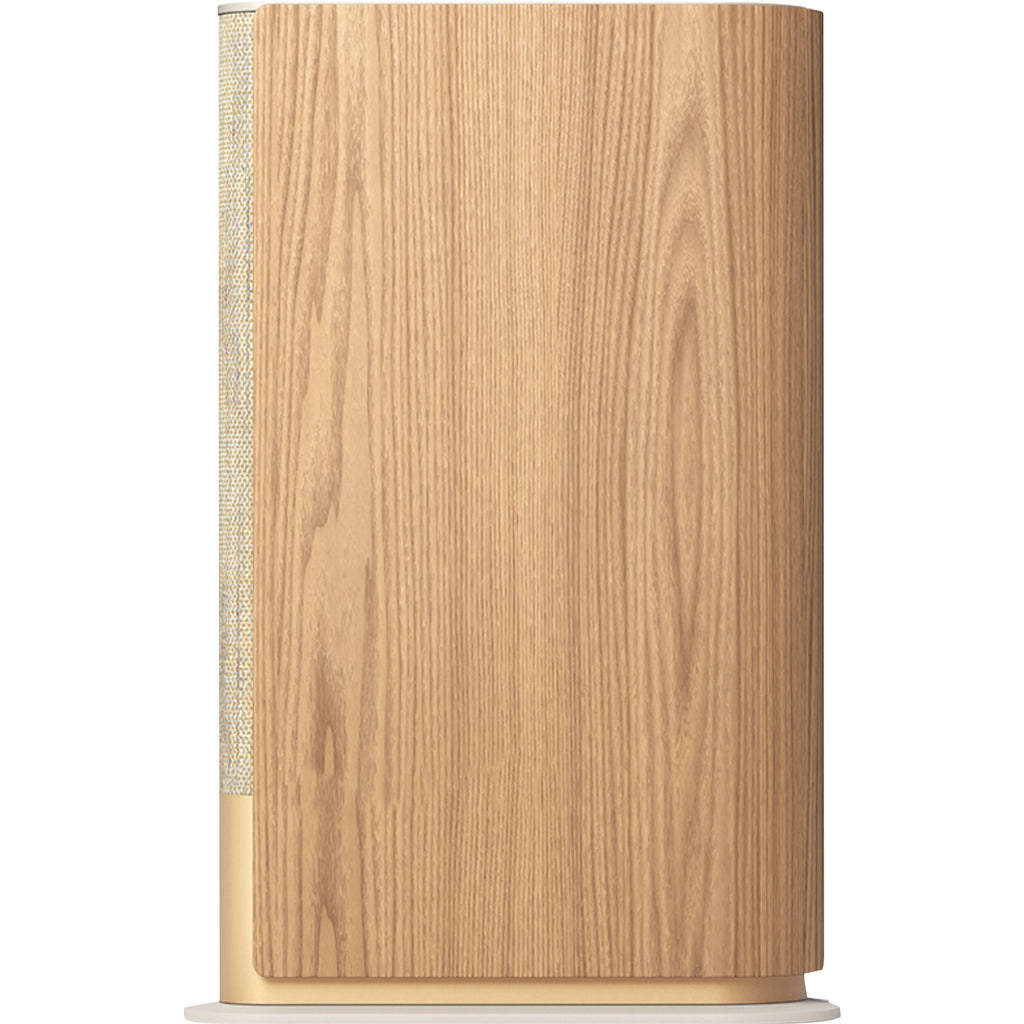 Bang & Olufsen Beosound Emerge wireless speaker in gold tone, showcasing its sleek, modern design and compact form.