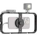 Rode Phone Cage mounted on tripod, holds smartphone for stable video recording or streaming setup.