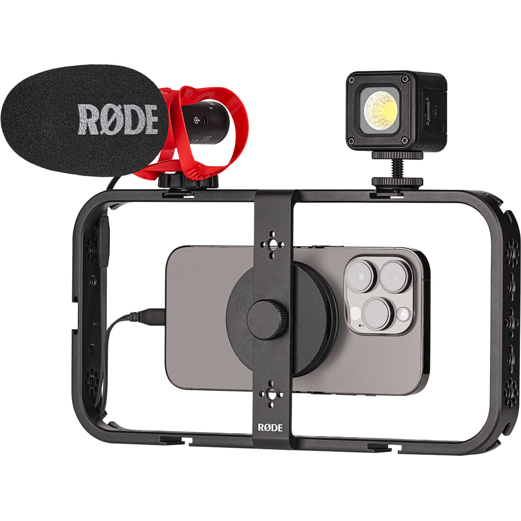 Rode Phone Cage mounted on a tripod with a smartphone inside, used for stabilizing phone video recordings and mobile filmmaking.