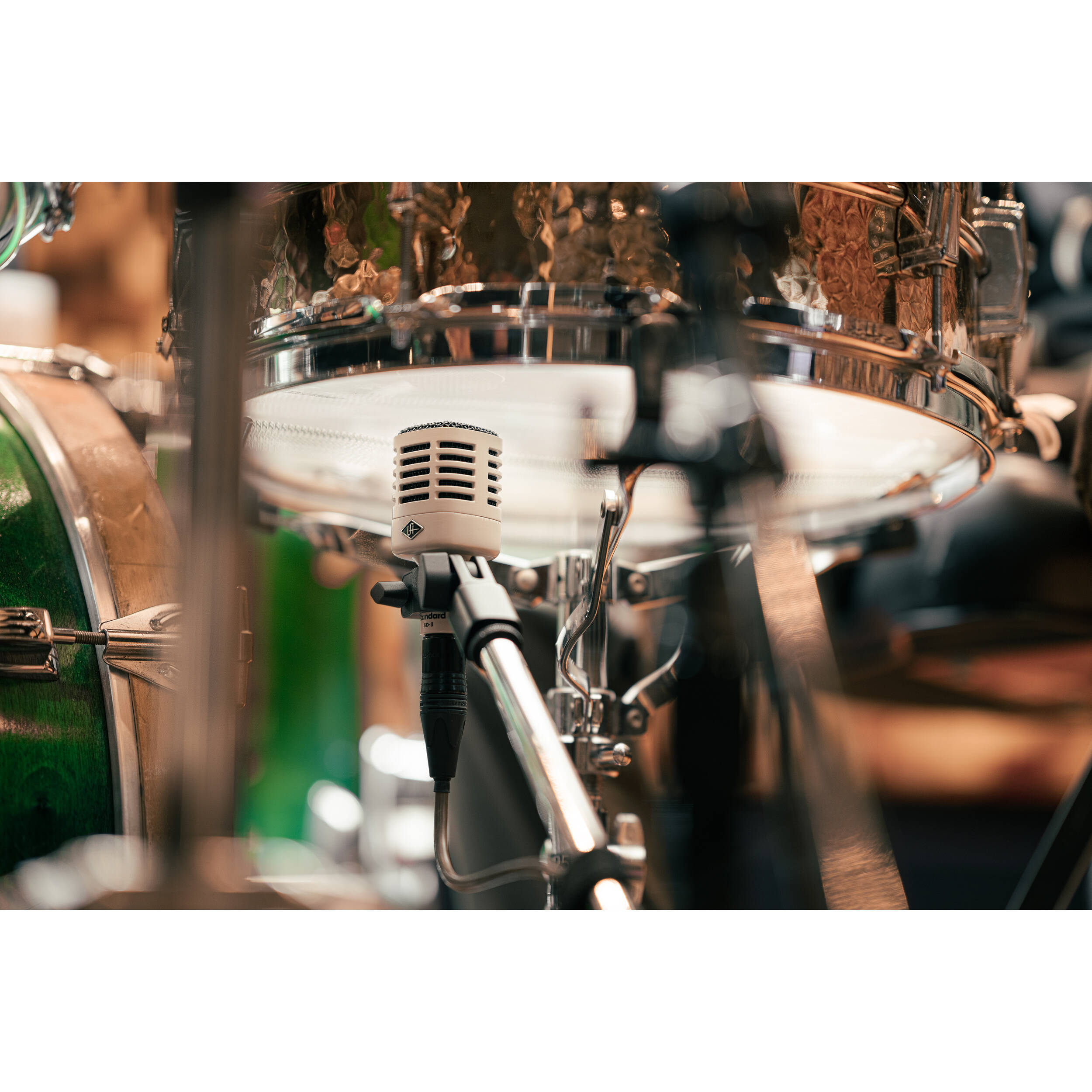 Universal Audio SD-3 dynamic microphone with studio-grade build, black metal body, and cardioid polar pattern for professional sound recording.