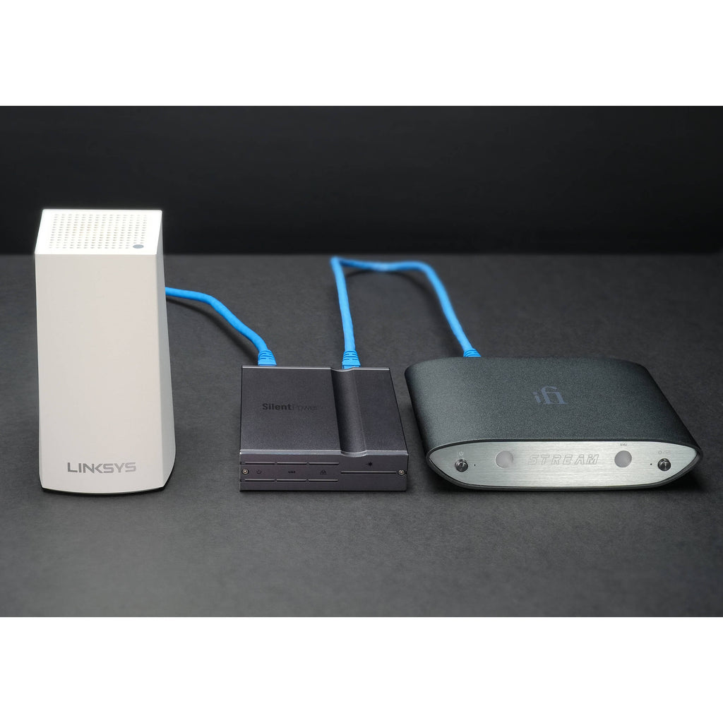 SilentPower LAN iPurifier Pro noise filter and conditioner, featuring a sleek design and cables connected for optimal performance.