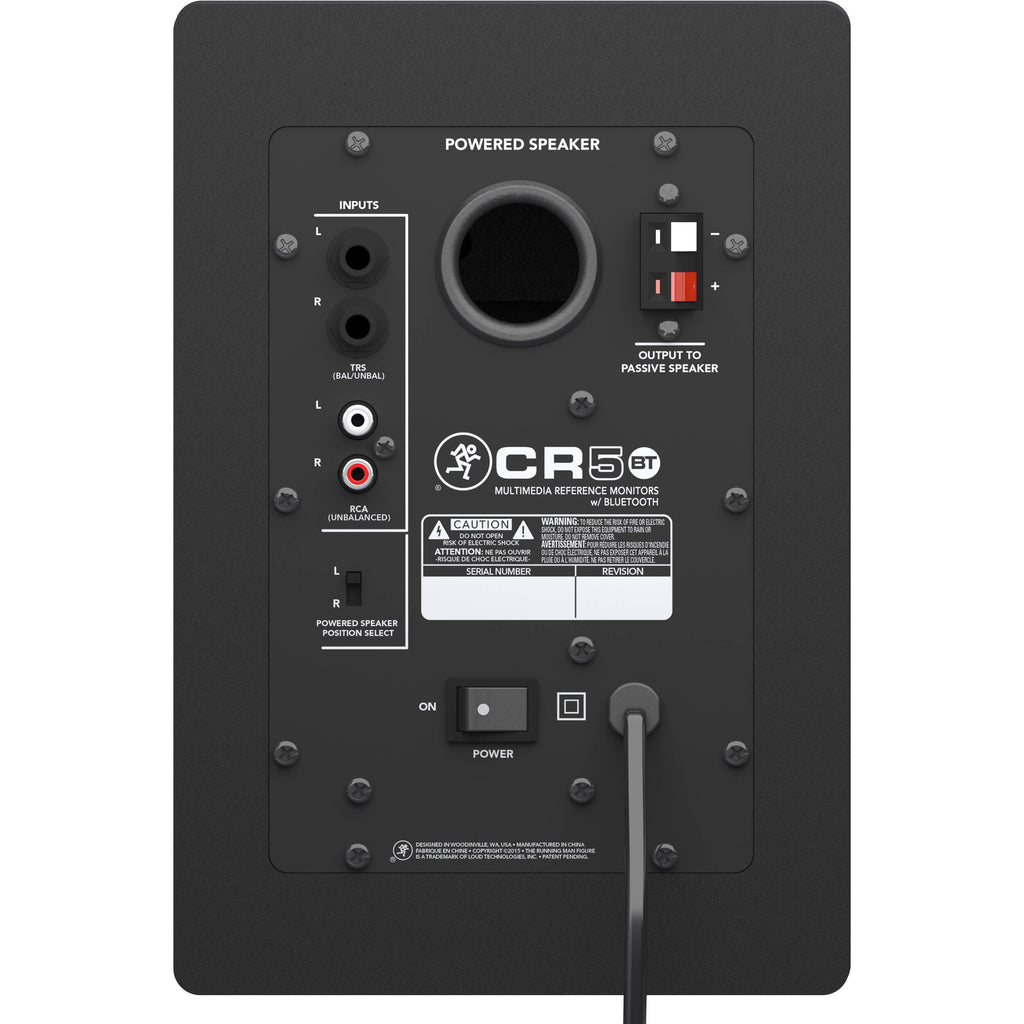Mackie CR5BT desktop speakers with black finish and control knobs on the front, designed for high-quality audio.