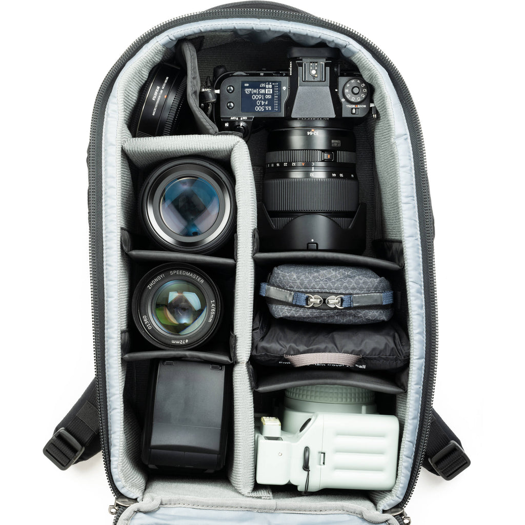Think Tank Walker Pro Series backpack with padded compartments for video equipment, black durable fabric, and multiple storage pockets.