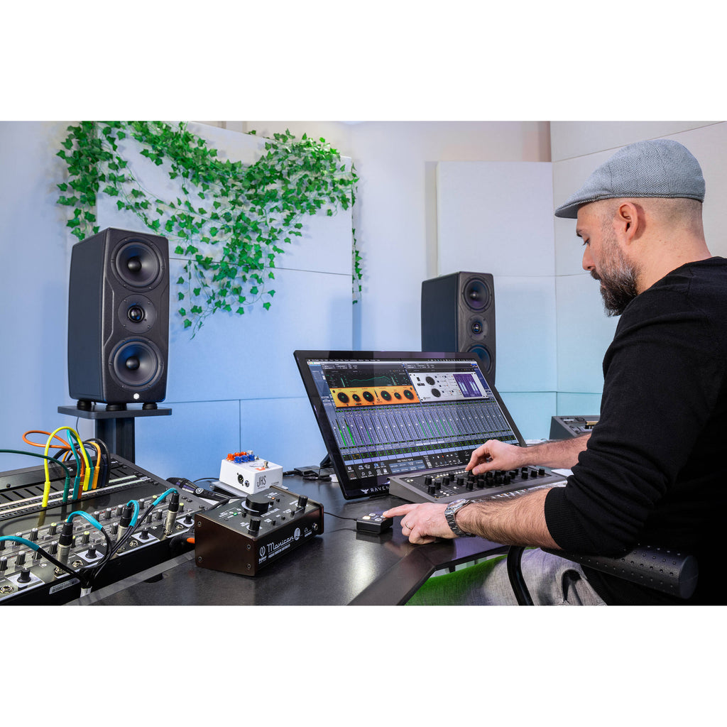 IK Multimedia iLoud Precision MTM MK2 active nearfield monitors with sleek black finish and multiple control knobs visible.