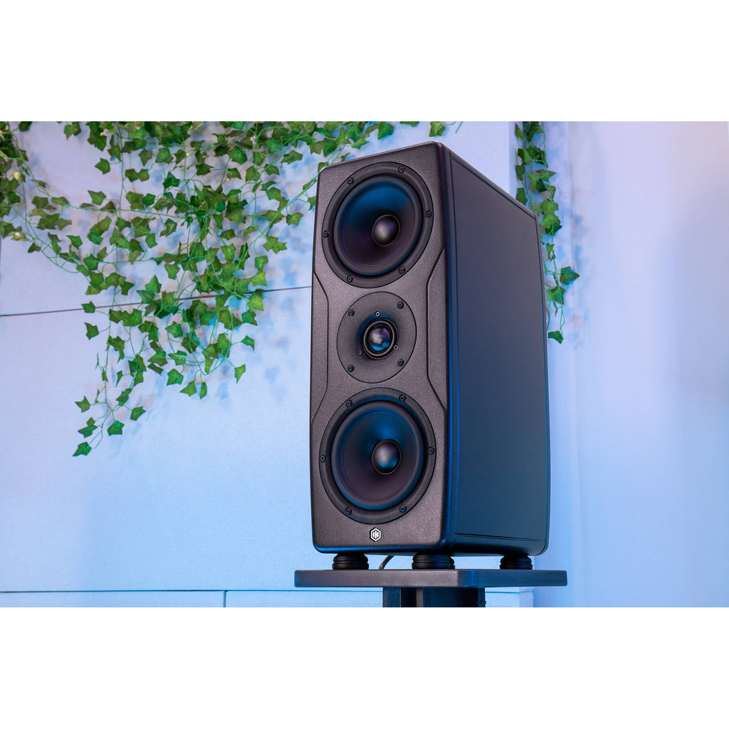 IK Multimedia iLoud Precision MTM MK2 active nearfield monitors with black finish and speaker grille, designed for professional audio.