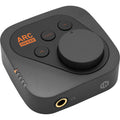 IK Multimedia ARC ON EAR headphone amplifier and DAC, close-up view showing controls and sleek black design.