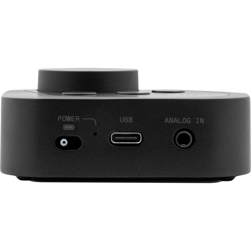 IK Multimedia ARC ON EAR headphone amplifier and DAC, compact device with controls and headphone jack, for high-quality audio listening.