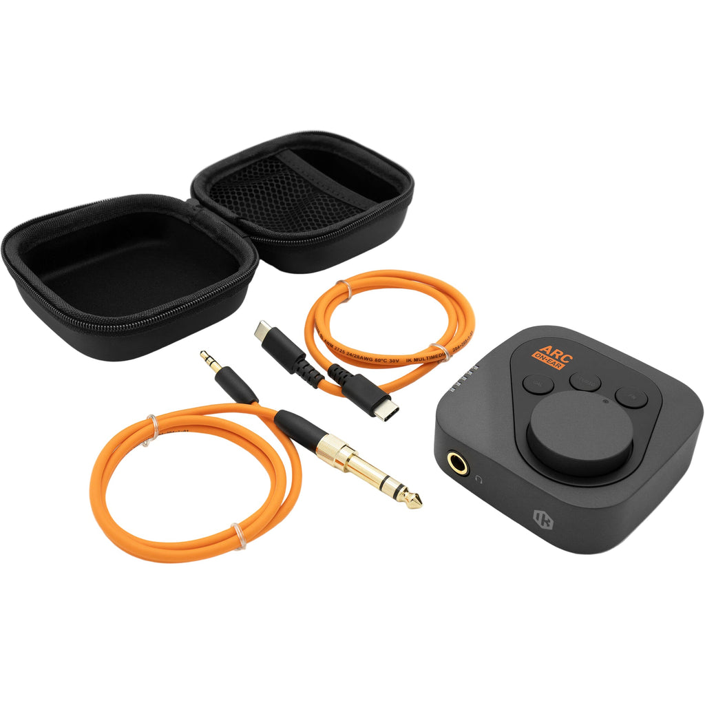 IK Multimedia ARC ON EAR headphone amplifier and DAC, showing sleek black design with control knobs and headphone jack for high-quality audio.