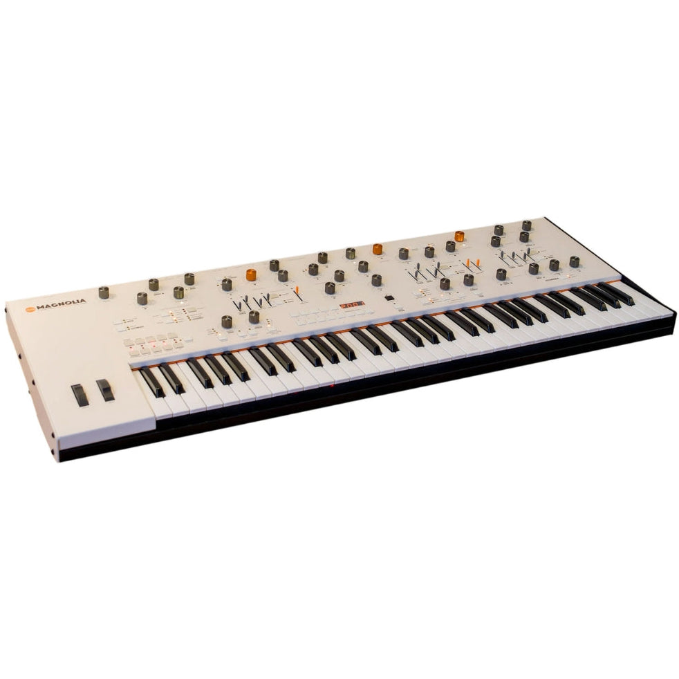 Frap Tools Magnolia keyboard synthesizer with black and silver control panels and various knobs and switches.