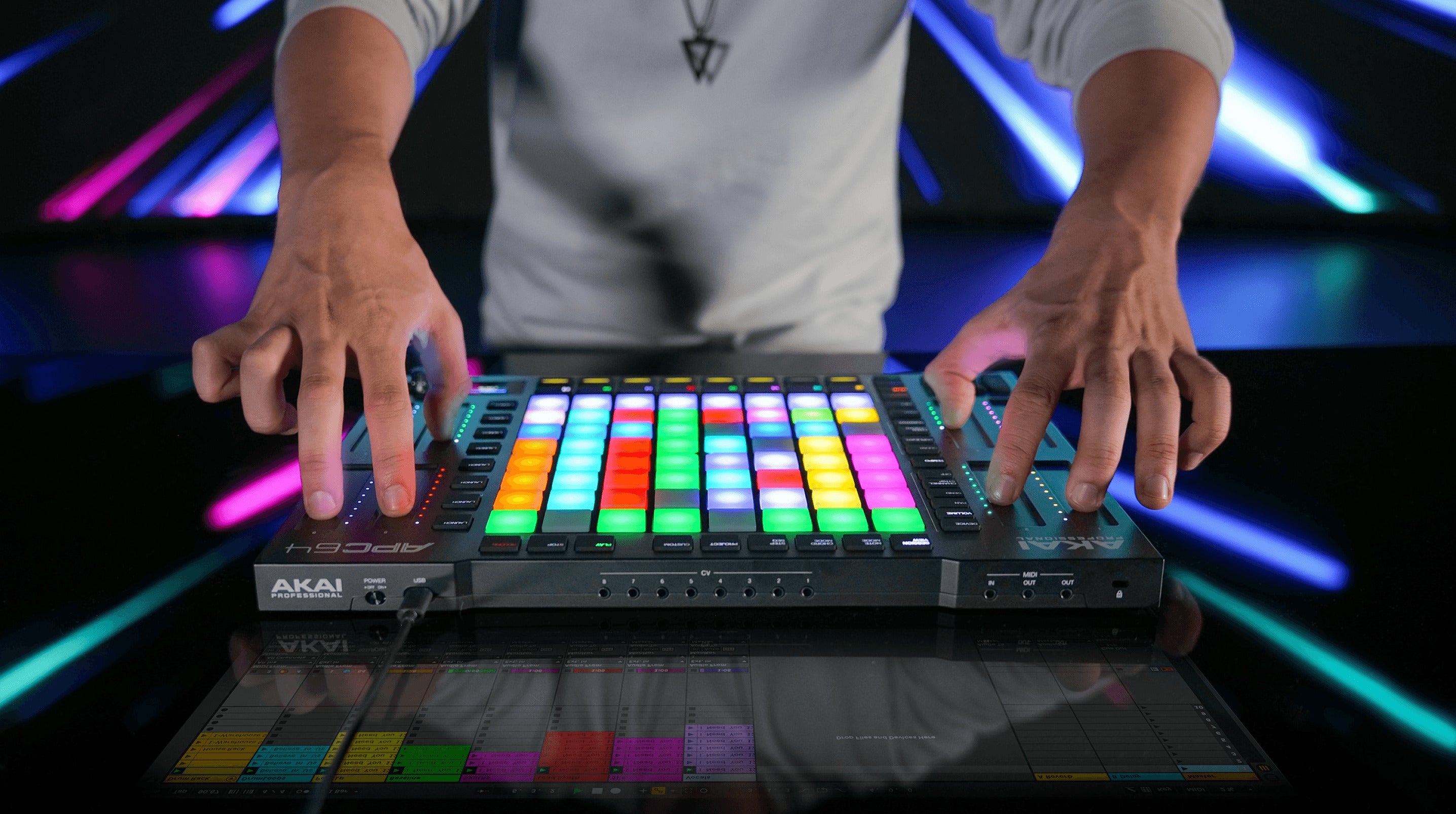 Akai Professional APC64 MIDI controller with grid of pads, knobs, and faders viewed from the top angle.