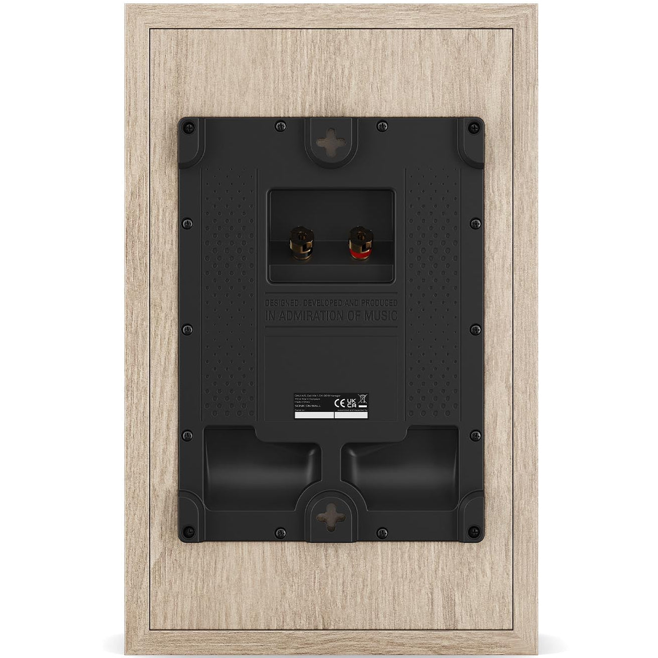 DALI Sonik On-Wall in-wall and outdoor speakers mounted on a wall, showcasing sleek design and grille details.