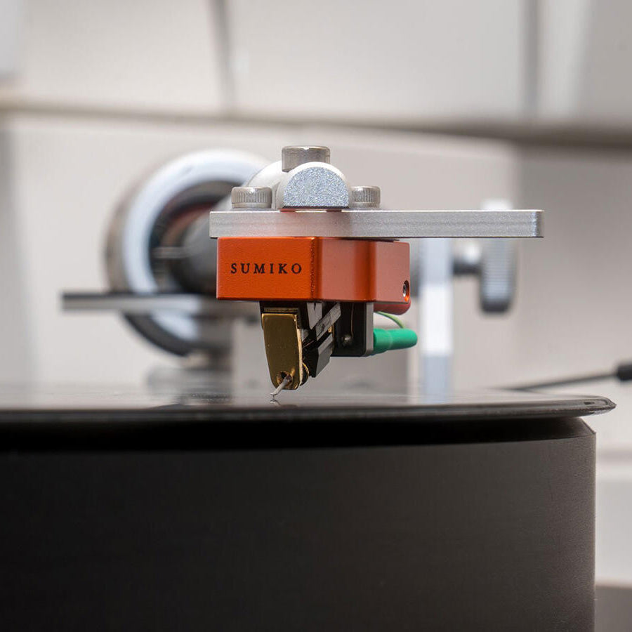Sumiko Oriole MC phono cartridge mounted on a turntable, showcasing detailed stylus and cartridge body.