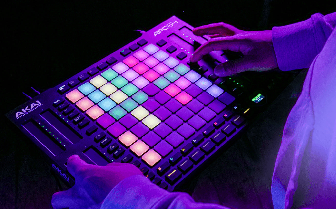 Akai Professional APC64 MIDI controller with grid of 64 colorful pads and control knobs for music production and performance.