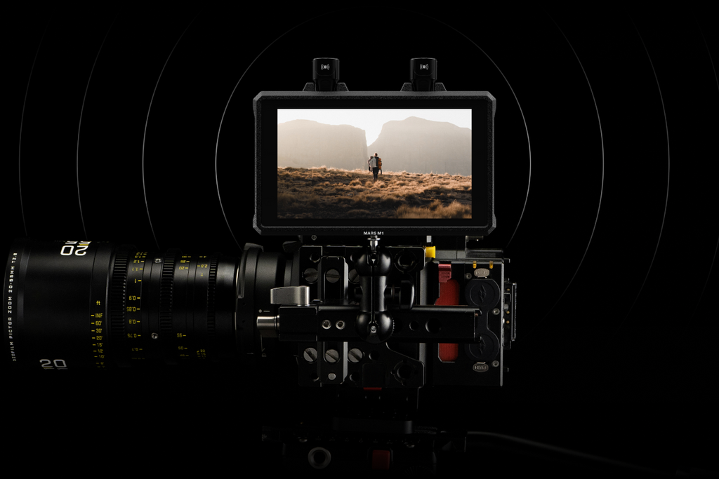 Two Hollyland Mars M1 Enhanced video monitors with antennas, displayed on a white background, showcasing their compact design.