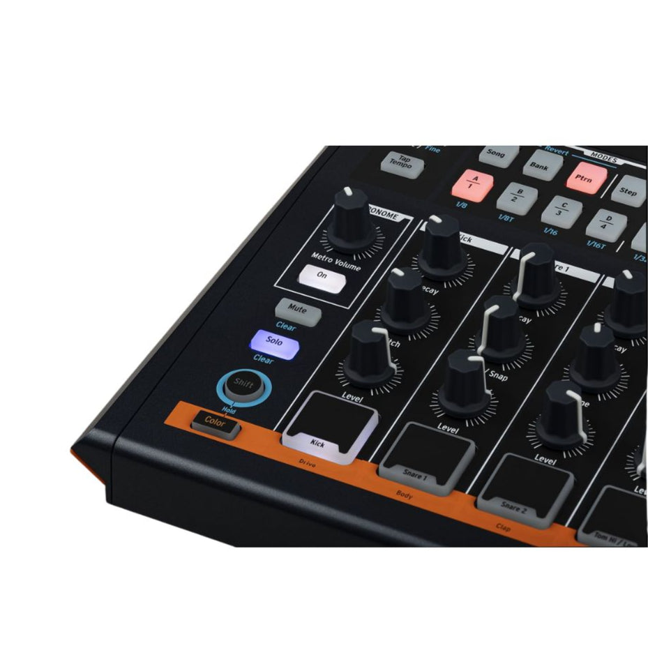Arturia DrumBrute Impact drum machine with colorful pads and control knobs for beat making and percussion programming.