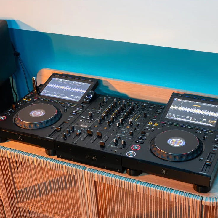 AlphaTheta DJM-V5 DJ mixer with multiple knobs, sliders, and input options, designed for professional DJ setups.
