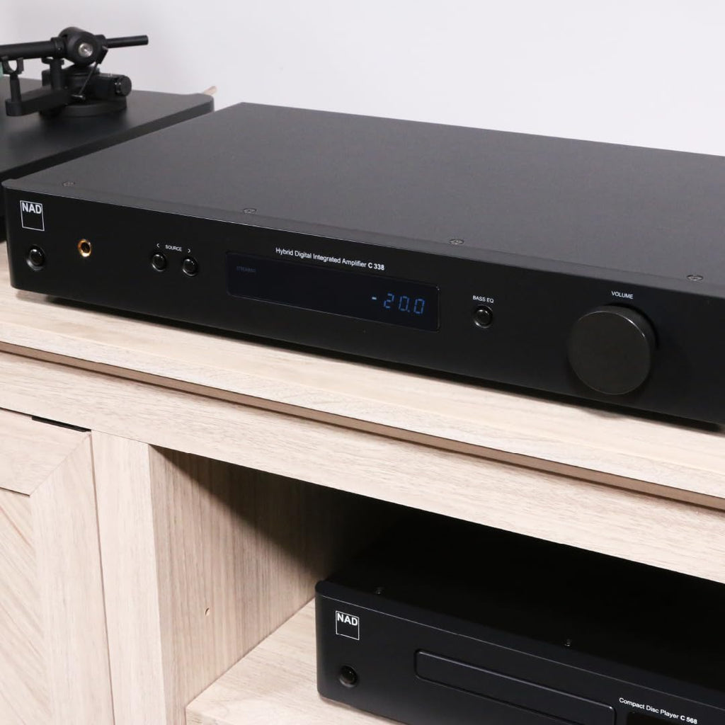 NAD C 338 stereo amplifier with sleek black finish and control knobs, designed for high-quality home audio listening.